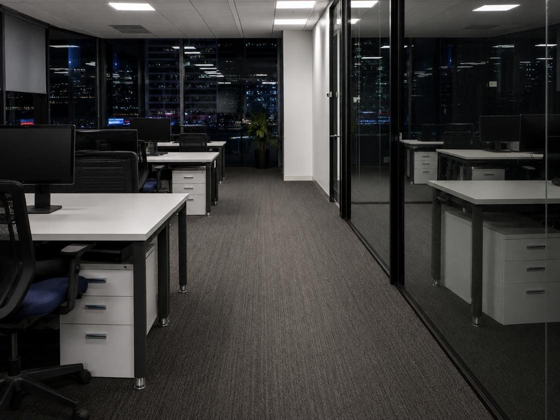 After — the same office cleaned and tidied, desks cleared and carpet vacuumed