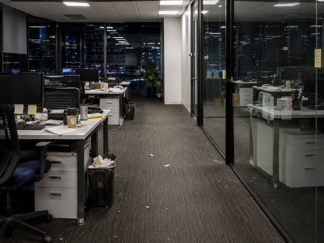 Before — an office with cluttered desks, rubbish and an untidy floor