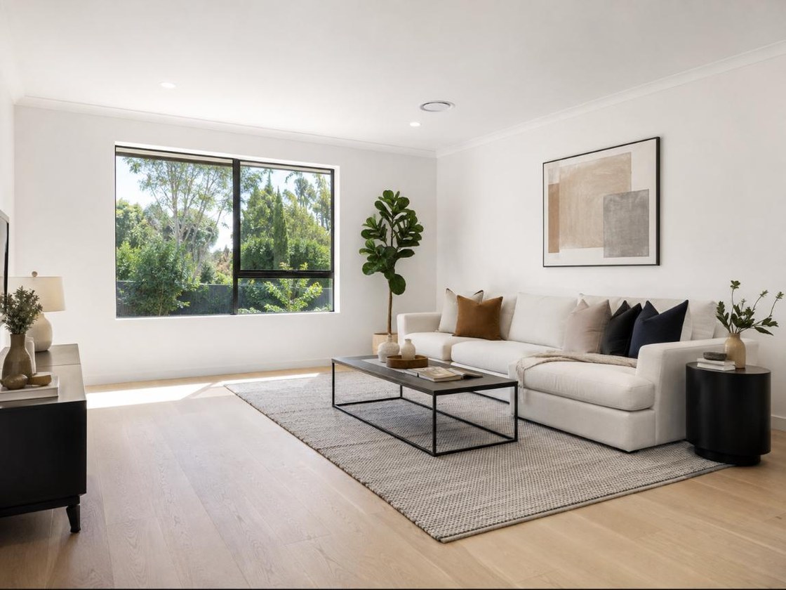 After — the same lounge cleaned after the renovation, dust and debris gone, floors and windows spotless
